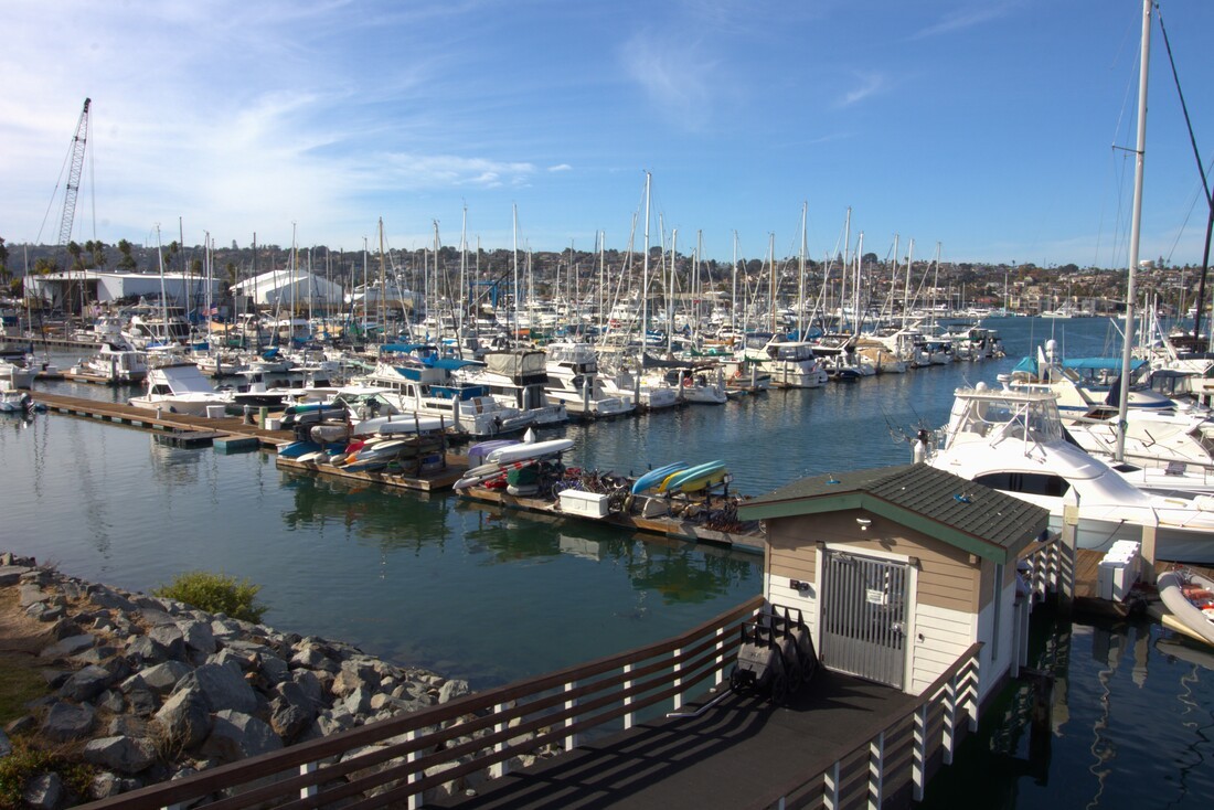 Shelter Cove Marina viewed from the gangway with yachts and sailboats in their slips