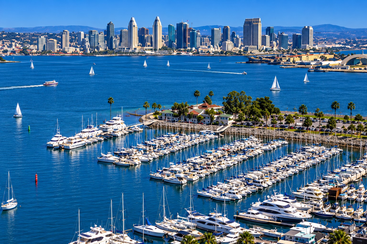 Aerial-style view across the marina and San Diego Bay toward the downtown San Diego skyline